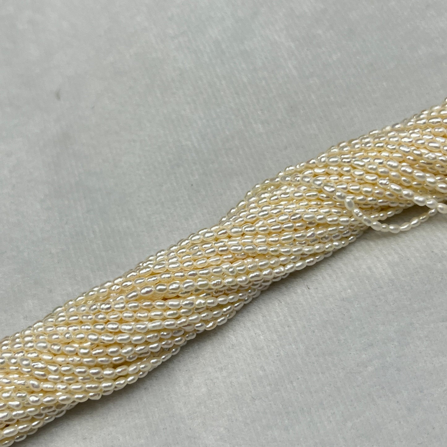 Fresh Water Pearl Off White Color, Rice Shape, AAA Luster Pearl, 2 MM Size